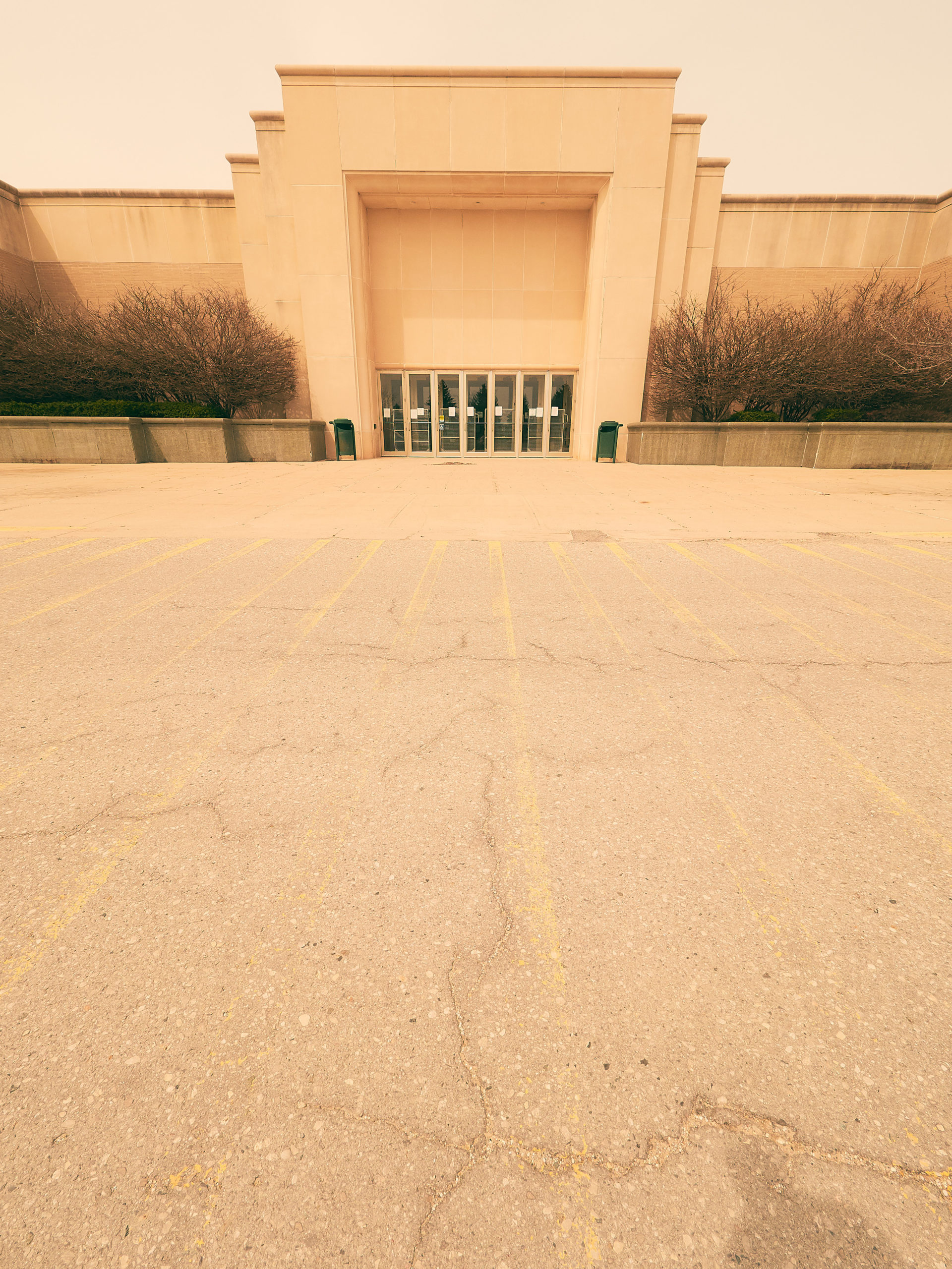 deserted mall entrance and parking lot during covid shutdown at grand traverse mall in traverse city Michigan