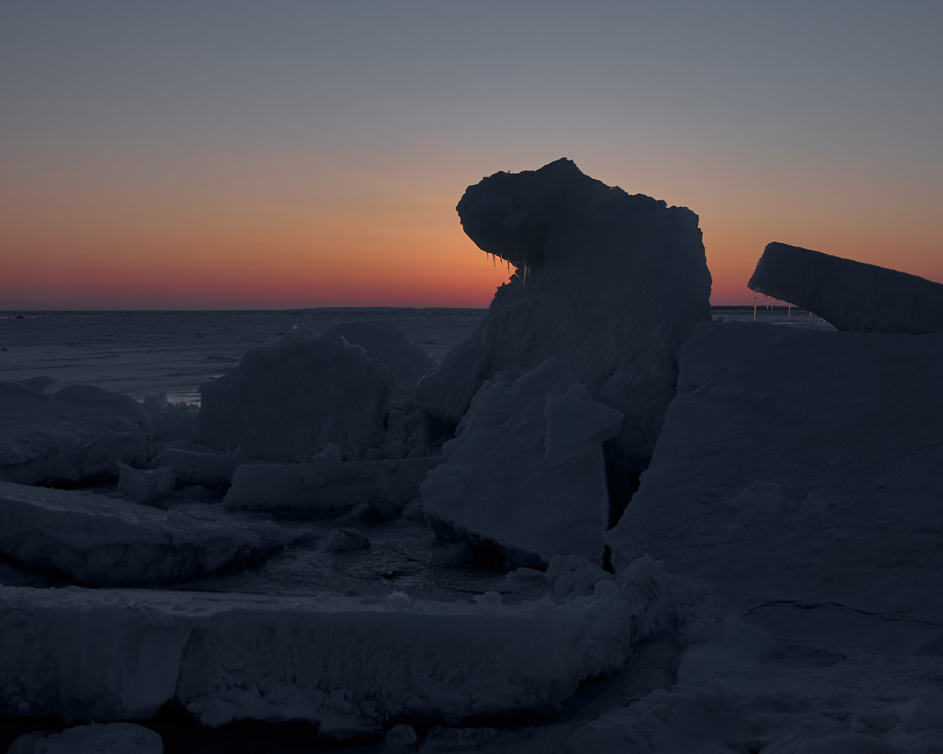 ice formation at sunset near vans beach in Leland Michigan