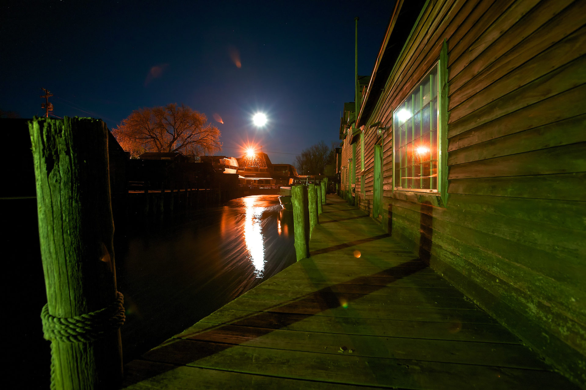 nightscape of the carp river in fishtown docks and shanty in Leland Michigan