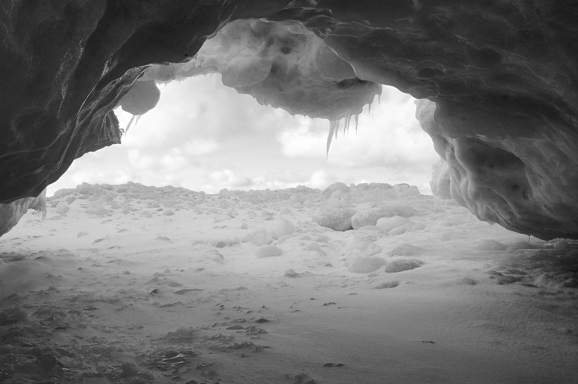 ice cave from shore ice at vans beach in Leland Michigan